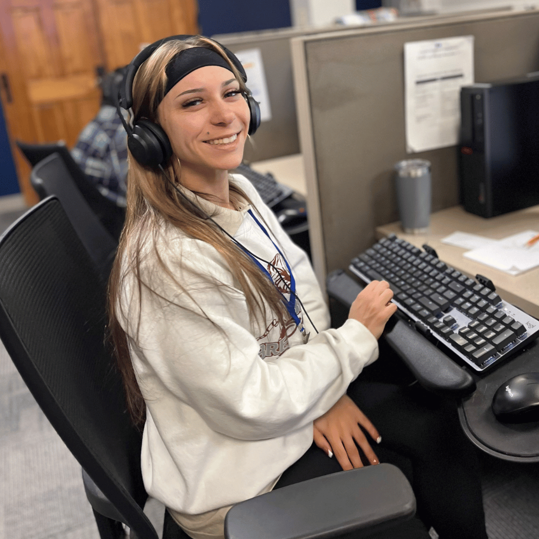 Dexcomm customer service representative smiling at camera Dexcomm customer service representative smiling at camera