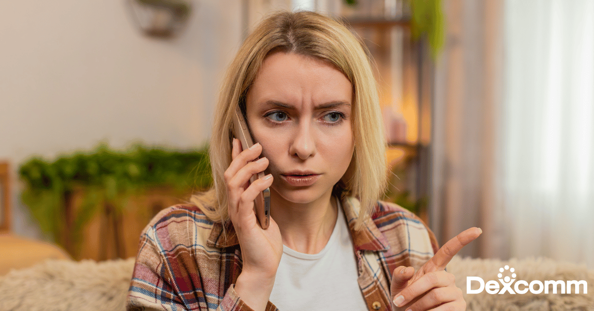 Frustrated customer on the phone with a Dexcomm logo