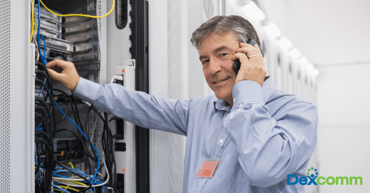 Technician on the phone with Dexcomm Logo