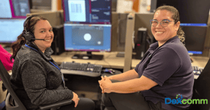 Industry-trained call agents smiling at the camera with Dexcomm logo