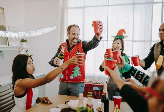 Employees having beverages at an office party