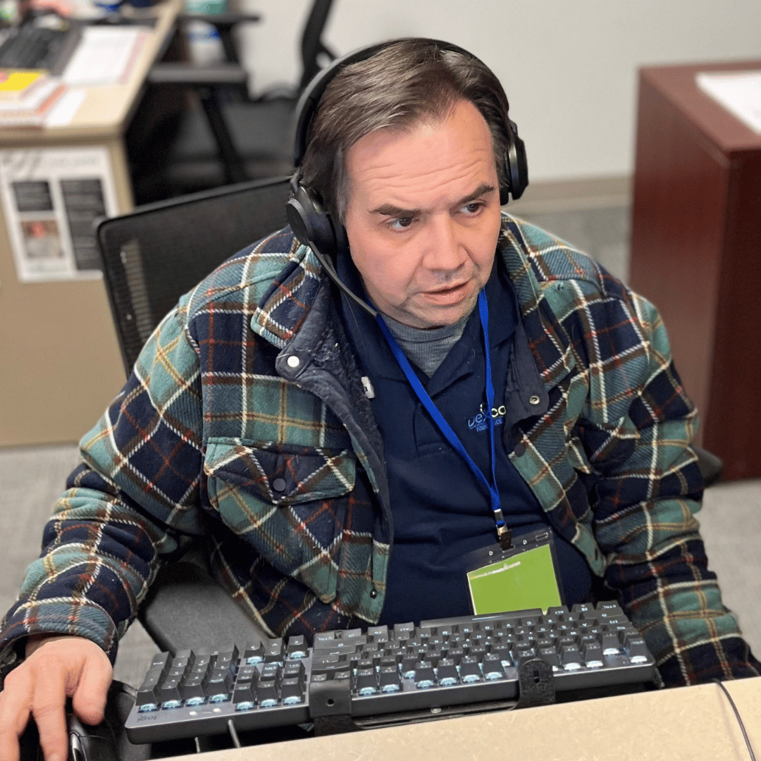 Dexcomm Telephone Answering Service Employee Taking a Call