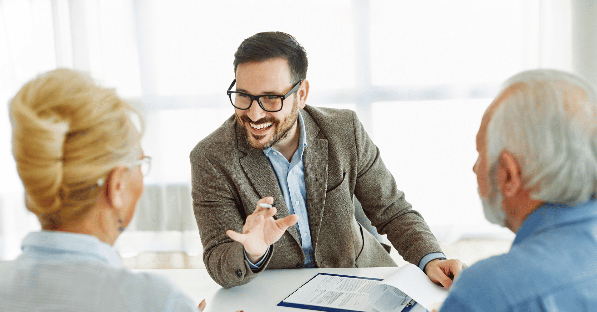 Man cordially speaking with experienced customers