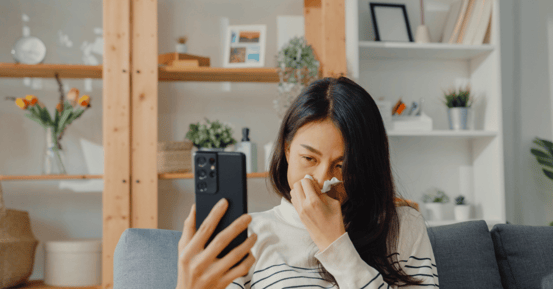 Lady with allergies on the phone