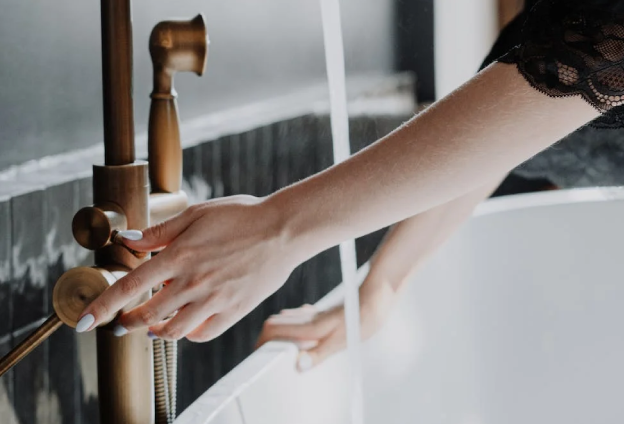 hands using a faucet