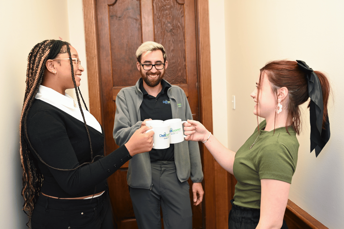 Dexcomm Call Center Employees Clinking Mugs