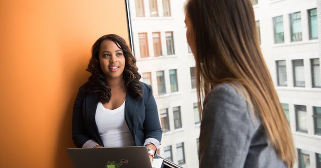 women discussing work